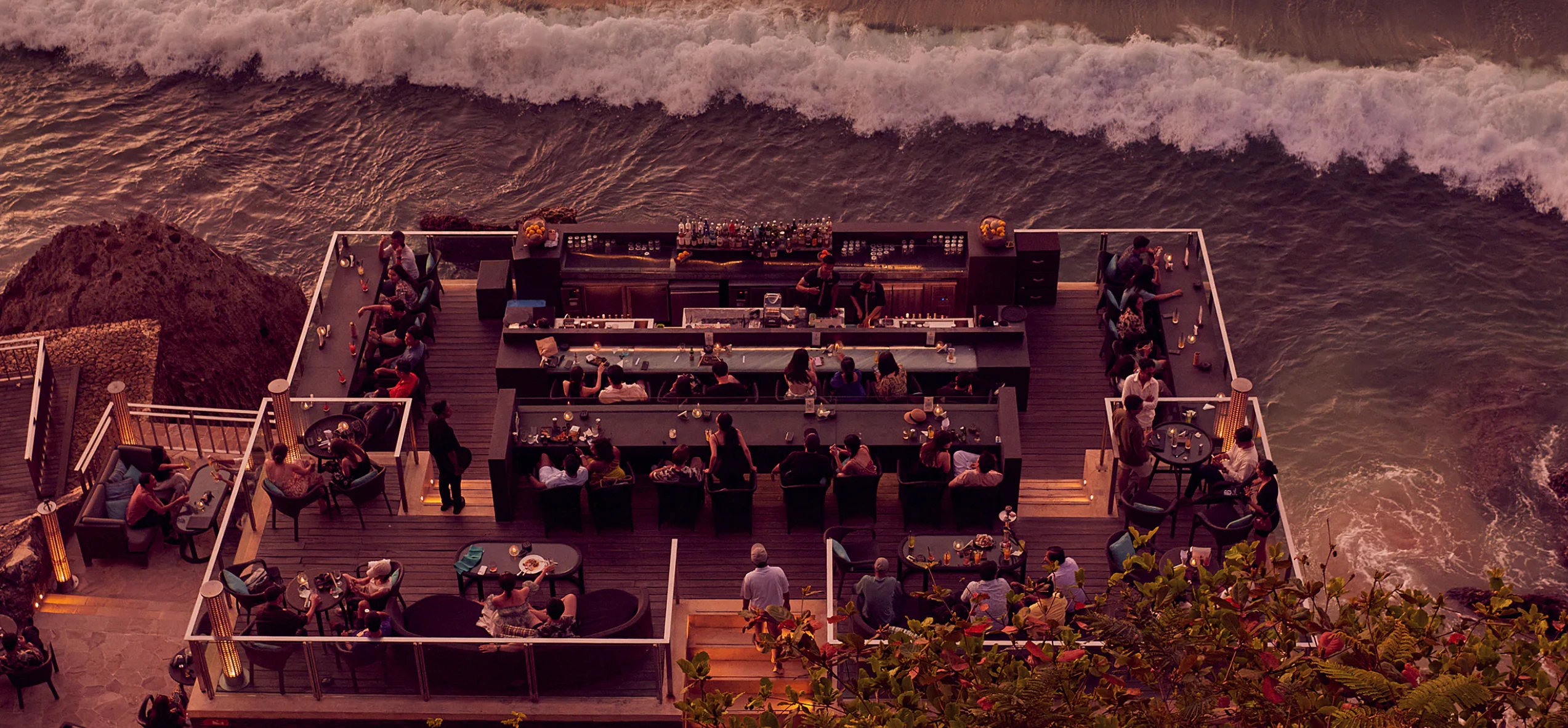 Rock Bar Bali overlooking Jimbaran Bay at sunset